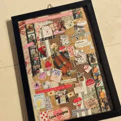 An angled view of a custom story frame, showing the depth and texture of the collage. This piece is filled with photos, notes, and stickers that represent a couple's journey, perfect for celebrating an anniversary or special milestone.