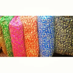 The foundation of any great outfit is the fabric. Here is a selection of the beautiful and vibrant brocade fabrics I source, featuring rich colors and intricate gold floral patterns ready to be turned into a custom creation.