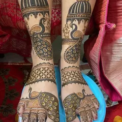 Bridal mehandi isn't just for the hands. I create stunning, intricate designs for the feet, like this one featuring majestic peacocks and detailed patterns that extend from the toes to above the ankles, ensuring a complete bridal look.