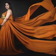 This mustard yellow gown with four flowing trails creates a stunning, ethereal effect for maternity photos. The color is warm, cheerful, and photographs beautifully.