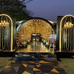 Your Sangeet night deserves a touch of glamour. We designed this stunning tunnel entrance with glowing arches, chandeliers, and shimmering curtains to make guests feel like they're walking into a star-studded event.