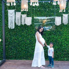 A sweet moment between a mother-to-be and her son, who is soon to be a big brother. We love capturing the entire family's excitement during this special time.