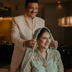 A father's blessing as he places the dupatta on his daughter's head. A moment filled with love, pride, and emotion that we are honored to capture.