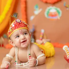 The sparkle in his eyes says it all! My Little Krishna themed shoots are a special way to celebrate our culture. I take care of all the details, from the costume to the set, to create a truly divine portrait of your little Kanha.