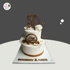 Celebrating 50 years of togetherness with this classic two-tiered anniversary cake. The design features elegant white and brown tones, delicate sugar flowers, and a custom topper marking the golden milestone.