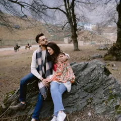 A quiet moment of rest amidst the raw beauty of the Kashmiri outdoors. It’s not a pose, but a pause, a shared breath in the middle of their adventure.