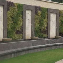 This grand installation featuring vertical gardens and water fountains is a testament to our ability to execute large, complex commercial projects. Such features significantly elevate the prestige and environmental commitment of a corporate headquarters or luxury establishment.