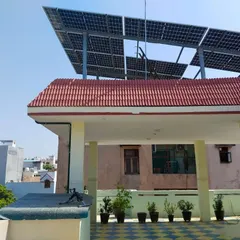 This view highlights how our elevated structures are positioned to integrate with the existing building design. We ensure every solar panel installation is both functional and visually compatible with your home.