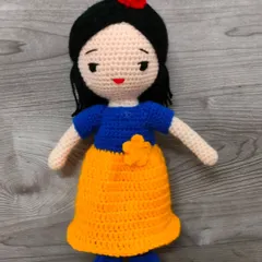 My version of the lovely Princess Snow White. She is dressed in her signature blue and yellow gown with a red bow in her hair. A perfect friend for any child who loves fairytales.
