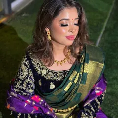 A beautiful South Indian inspired half-saree look, showing the intricate velvet blouse and the perfectly draped saree.