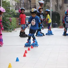 We use cones and other tools to make learning fun. Here, a young skater practices his slalom skills during a class in a Bengaluru apartment complex.