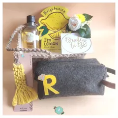 A "Bride to Be" hamper with a cheerful yellow theme. Curated by a bridesmaid, it includes a lemon face mask, a personalized pouch, and other pampering essentials for the final countdown.