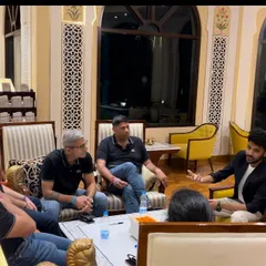 Performing in a relaxed lounge setting for a private get-together. This shows how I can adapt to any environment, turning a casual chat into an impromptu magic show.