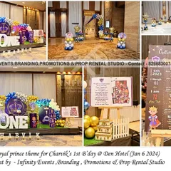 A full view of Charvik's royal prince themed first birthday. The setup features a large "ONE" table, a milestone board, and an elaborate balloon garland over a sequin backdrop, perfect for a grand celebration.