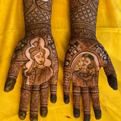 This is a close-up of the bride and groom portraits from the Mangalore-Mumbai themed mehendi. You can see the fine lines and shading techniques I use to bring the faces to life, making them recognizable and full of character.