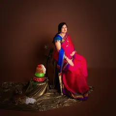 To a forever of elegance. A beautiful portrait of an expecting mother in a vibrant pink and blue saree, celebrating the life she is about to bring into the world.
