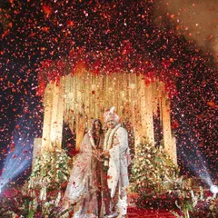 A shower of petals for the perfect Varmala. We use effects like this confetti cannon to create a huge visual impact, making key moments like the garland exchange feel incredibly grand and celebratory.