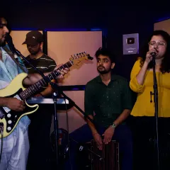 Collaboration is at the heart of our bootcamps. This is a snapshot of a jam session where students work together, combining guitar, vocals, and percussion to create music on the spot. It's a fantastic way to learn and connect with fellow musicians.