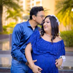 An intimate moment between the expecting couple. My focus here is on capturing the genuine affection and excitement you share.