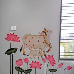 Creating spiritual art for a pooja ghar is a process of devotion for me. This mural features the sacred Kamdhenu cow and her calf surrounded by lotuses, painted in a traditional style to bring blessings and tranquility to the home.