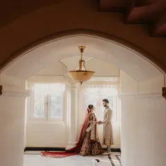 A quiet moment between the couple, framed by the elegant architecture of the Taj Mahal Palace. This is a classic example of our pre-ceremony couple portraits.