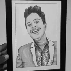 A framed A5 pencil sketch being held up for display. This shows how a smaller, affordable sketch can become a meaningful and high-quality gift.