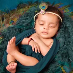 Another beautiful angle from our newborn Krishna session, focusing on the baby's peaceful sleep. We carefully pose little ones to get these timeless, heartwarming images you'll cherish forever.