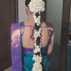 Another view of the stunning cascaded gajra braid, a beautiful hairstyle choice for South Indian brides.