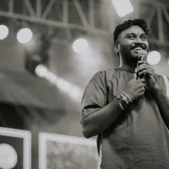 A black and white shot capturing a moment of joy while speaking to the audience. Being on stage, connecting with people through dance, is a feeling I cherish.