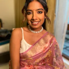 Another shot of Aarya's beautiful, natural makeup. The focus is on glowing skin and softly defined eyes, a look that's always in style.