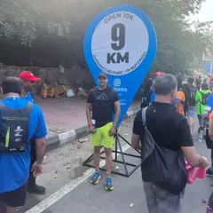 At the 9 KM mark of the Open 10K race. Endurance running requires mental toughness as much as physical training, a principle I instill in my coaching.