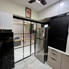 This view shows the fluted glass partition separating the kitchen from the living area, allowing for an open feel while containing cooking smells.