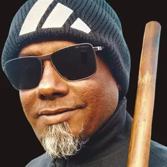 A portrait with a Bo Staff. This simple wooden staff is a versatile and effective weapon, and one of the first we introduce in our weapons program.