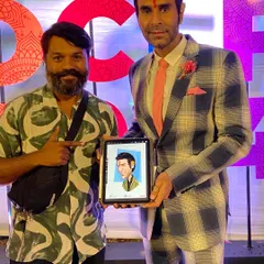 A proud moment presenting my digital caricature to the legendary choreographer and actor, Sandip Soparrkar, at the Orange City Literature Festival in Nagpur.