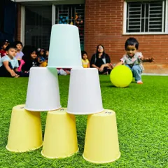 Even simple props can create a great challenge. This cup stacking game is a fantastic activity for developing focus, patience, and hand-eye coordination.