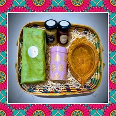 My special Diwali hamper, featuring almond and walnut laddus, nut butters, and millet flakes chivda, complete with a traditional diya. It's the perfect way to share health and happiness.