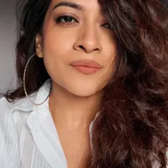 This look features a classic nude lip and simple eye makeup, paired with a crisp white shirt. It's a clean, modern, and confident style that works for any occasion.