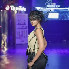 A model strikes a pose in an avant-garde piece from 'The Showcase Project'. My photography highlights the unique structure and design of creative fashion.
