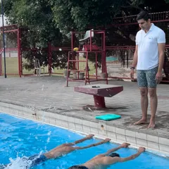 We focus on foundational skills, like practicing kicks at the pool's edge for stability and strength, before moving into open water.