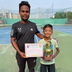 A closer look at Nivaan Dhama with one of the three trophies he won in a single tournament, including titles in the Under-8 and Under-10 aptitude categories.