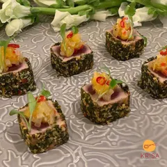 Herb-crusted seared tuna topped with a zesty pineapple salsa. This Pan-Asian inspired canapé is a burst of fresh, vibrant flavors, demonstrating our culinary range for sophisticated palates.