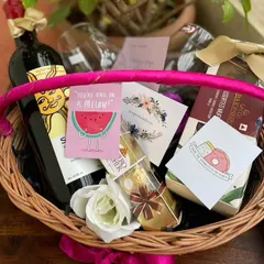 This vibrant anniversary basket is designed for a fun loving couple. It includes a bottle of non alcoholic wine, Ferrero Rocher chocolates, assorted muffins, and quirky, cute cards like "You're one in a melon!" to add a playful touch to their celebration.