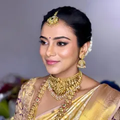 Another angle of this radiant bridal look, showing how the makeup catches the light beautifully. The focus is on clean, enhanced features and skin that looks like skin.