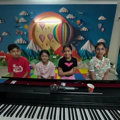 A lovely group of students ready for their class. The colorful and inspiring environment of our studio makes learning fun.