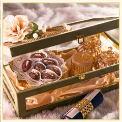 A luxurious velvet box hamper for Ramadan, filled with premium stuffed dates, an elegant candle, and other keepsakes. It's a perfect gift for Iftar gatherings.