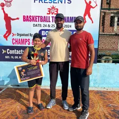 Here is one of my young champions with his trophy and certificate at a 3x3 basketball tournament. His hard work in our training sessions showed on the court.