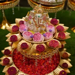 I pay a lot of attention to the details. This Ganesha idol placed on a brass lotus stand with fresh flowers is a centerpiece that brings blessings and beauty to the occasion.