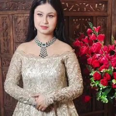 The same ivory off-shoulder gown, this time styled with a statement emerald and diamond necklace. This shows how you can accessorize my outfits to make them your own.