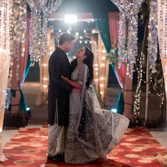 Dancing under a canopy of lights, lost in their own world. This photograph is about capturing the magic and romance of your reception celebration.