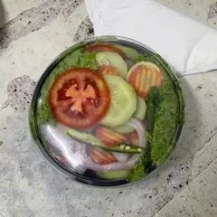 Sometimes, simple is best. Our classic green salad includes fresh lettuce, crunchy cucumber, onions, and tomatoes, packed hygienically and ready to eat.